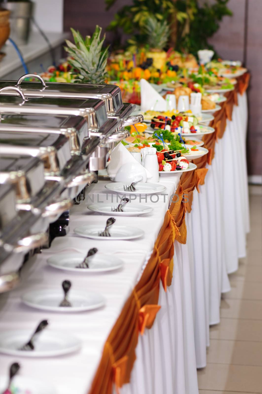 chafing dishes at table ready for wedding catering