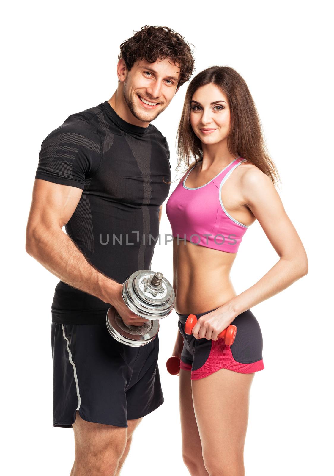 Athletic man and woman with dumbbells on the white by vlad_star