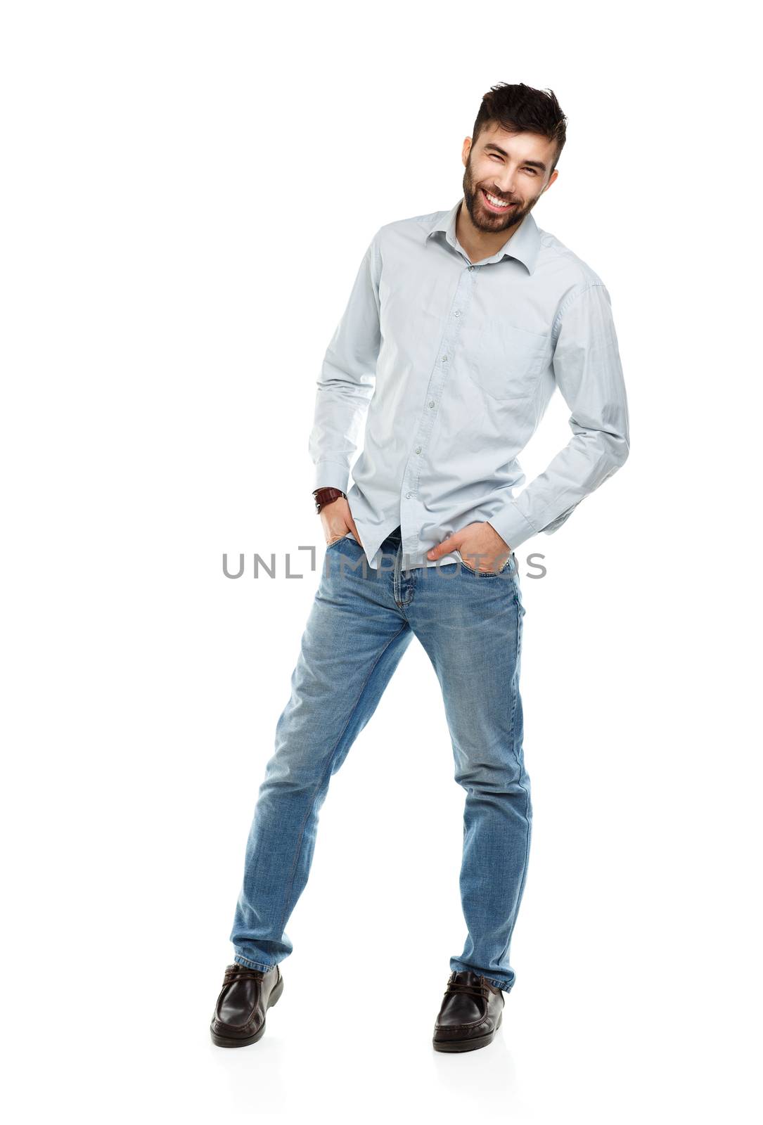 A young bearded man smiling isolated on white background