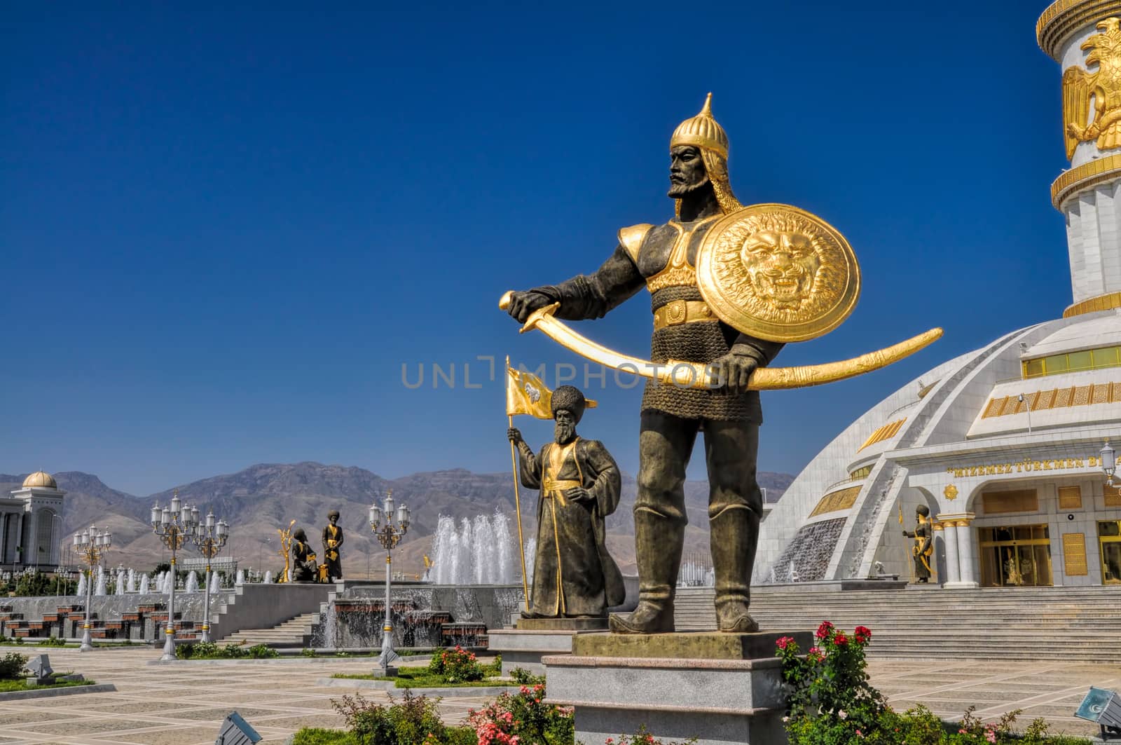 Statues around monument of independence in Ashgabat, capital city of Turkmenistan