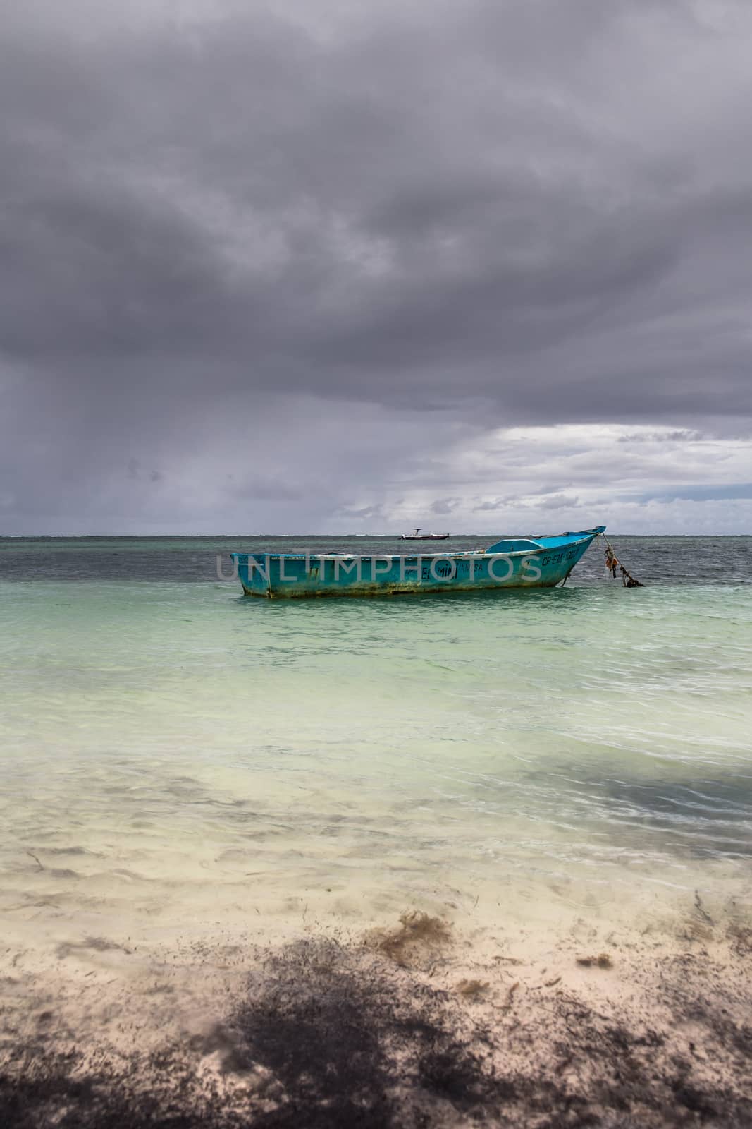 Boat on the sea before the storm on a Caribbean island