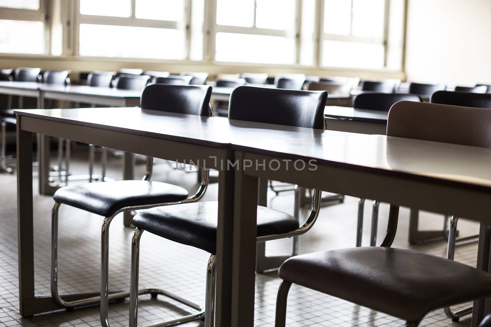 Empty classroom with chairs and desks by viktor_cap