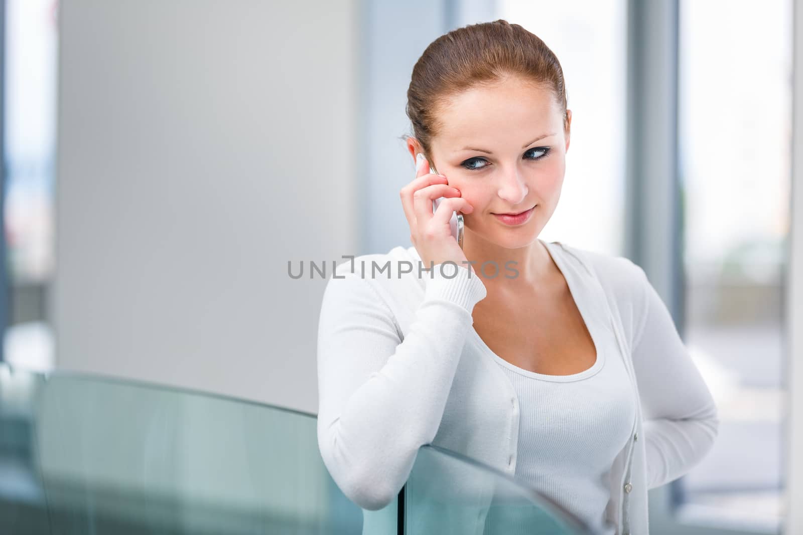 Pretty, young woman calling on her call phone by viktor_cap