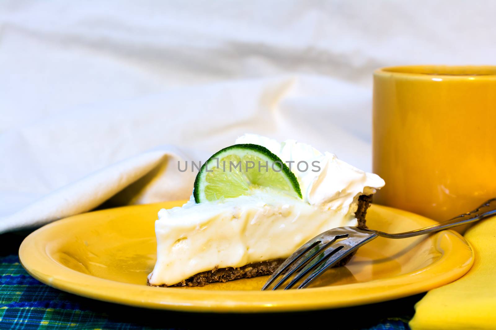 Key Lime Pie with Coffee Closeup by dehooks