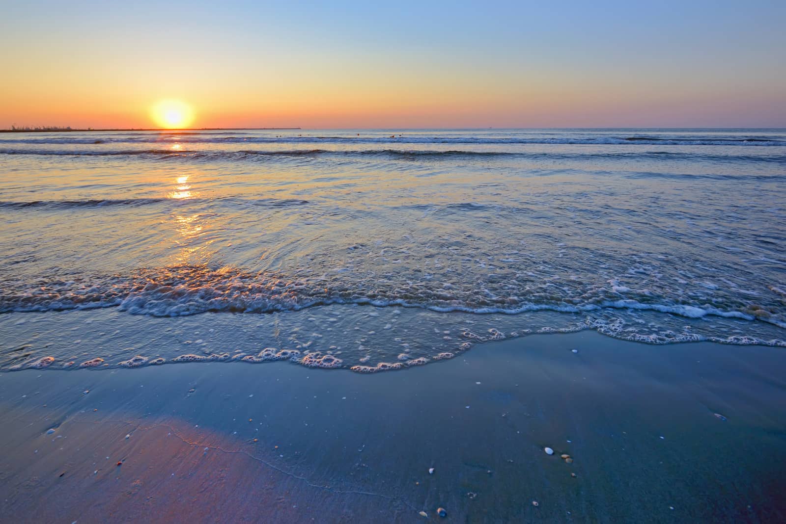 waves and sunrise on Black Sea beach