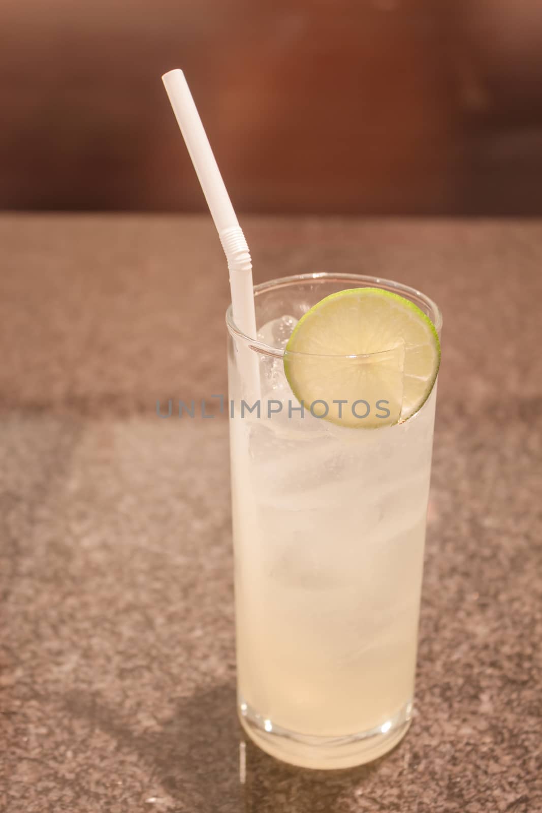 Glass of ice lemon juice by punsayaporn