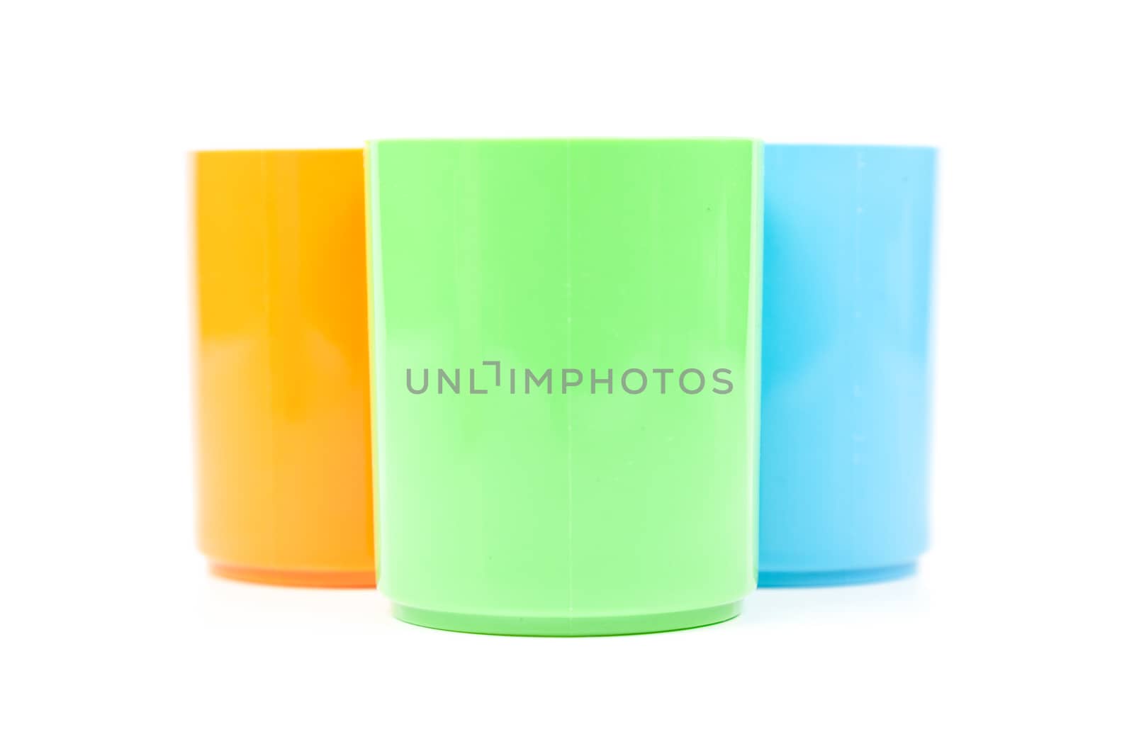 colorful variety of plastic cups. Isolated white background. plastic cups, taken within the studio.