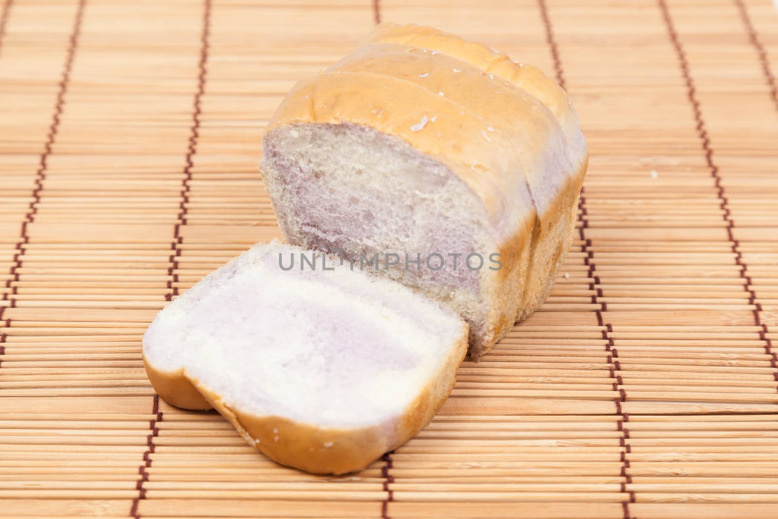 Sliced bread Placed on wood. Bread is cut into pieces evenly.