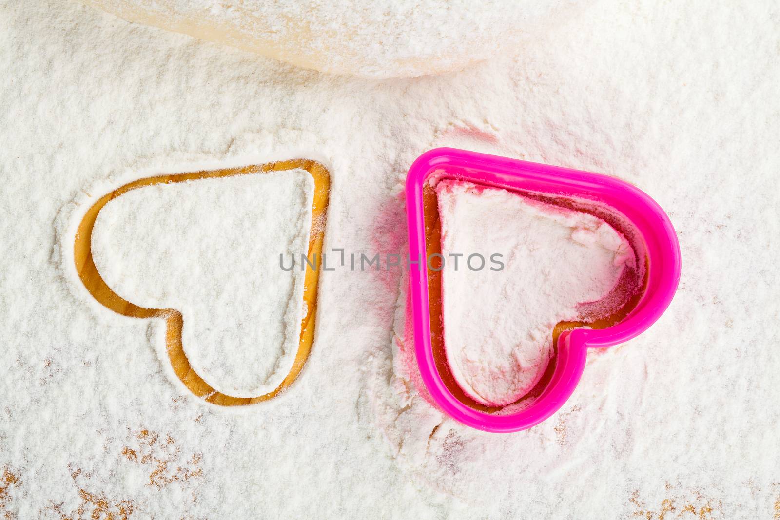 heart shaped cookie cutter on flour