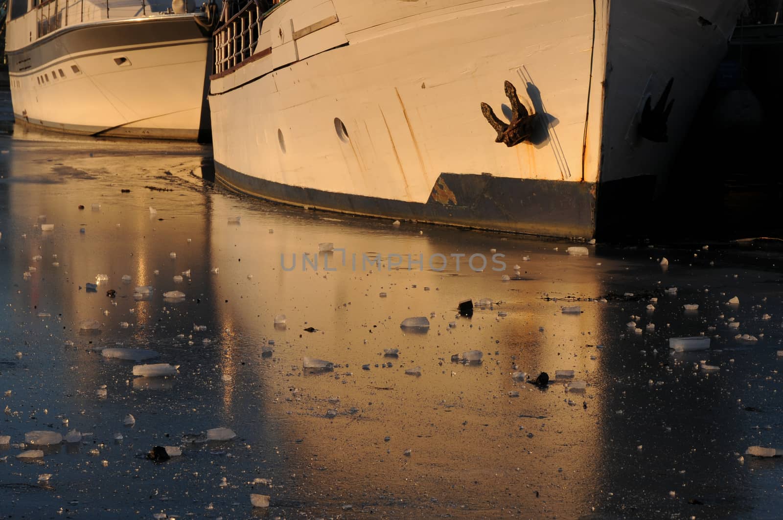 Boats stuck in frozen ice in a habour