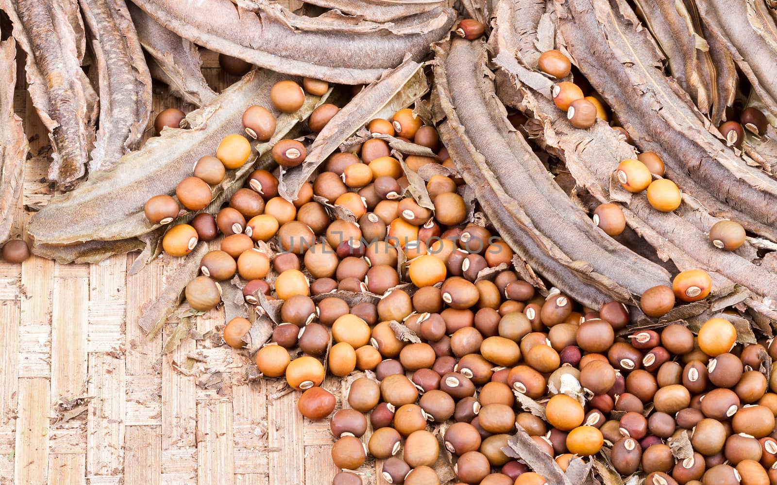 dried Winged Bean seed and bean pod on bamboo basket