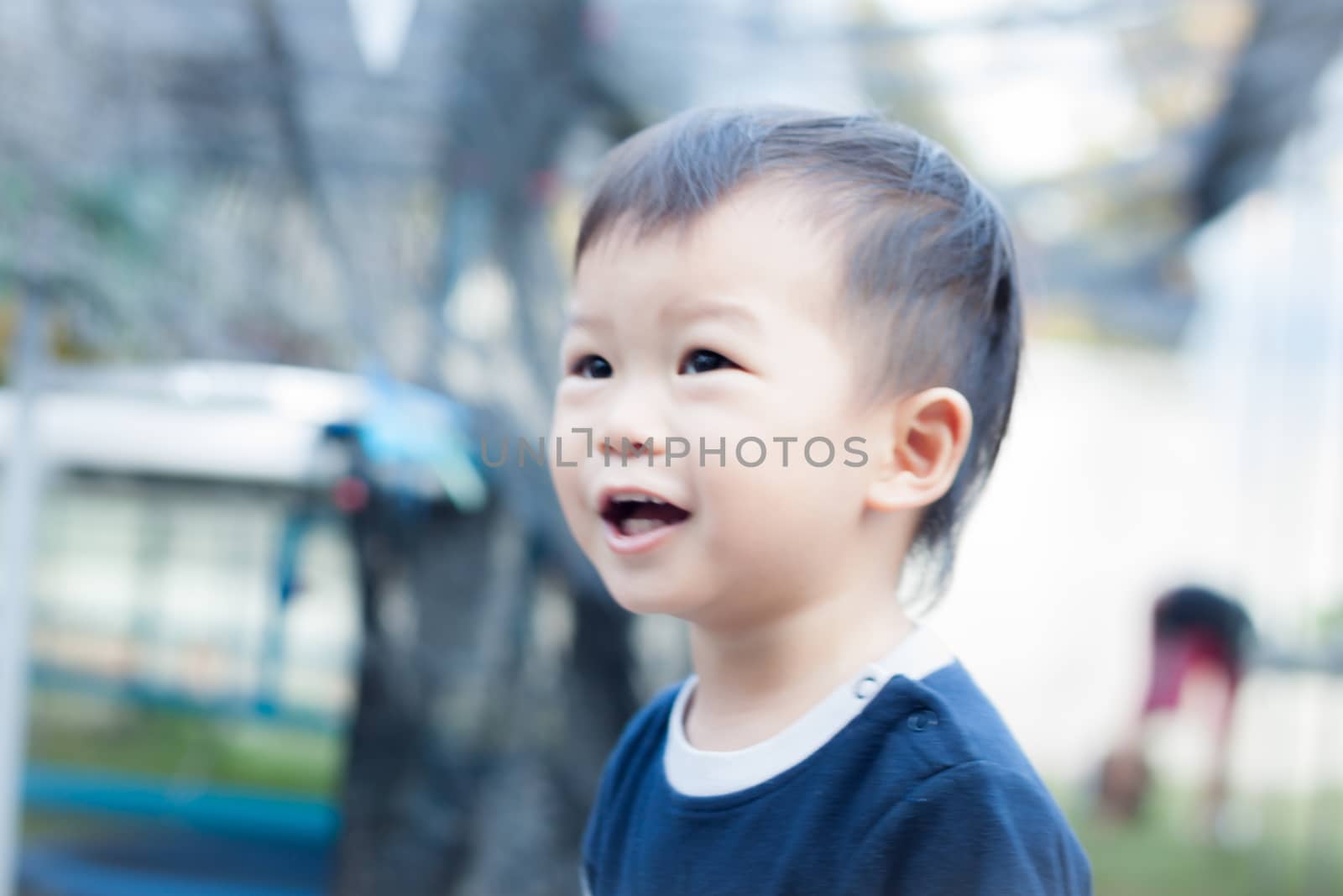 Little asian boy play at playground by punsayaporn