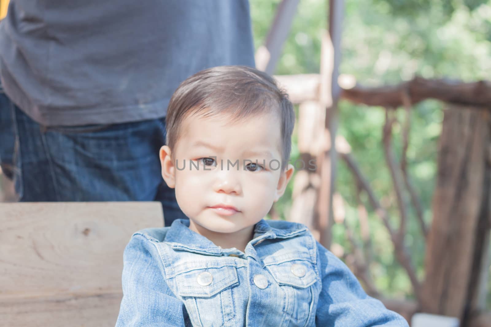 Cute asian boy looking at camera, stock photo