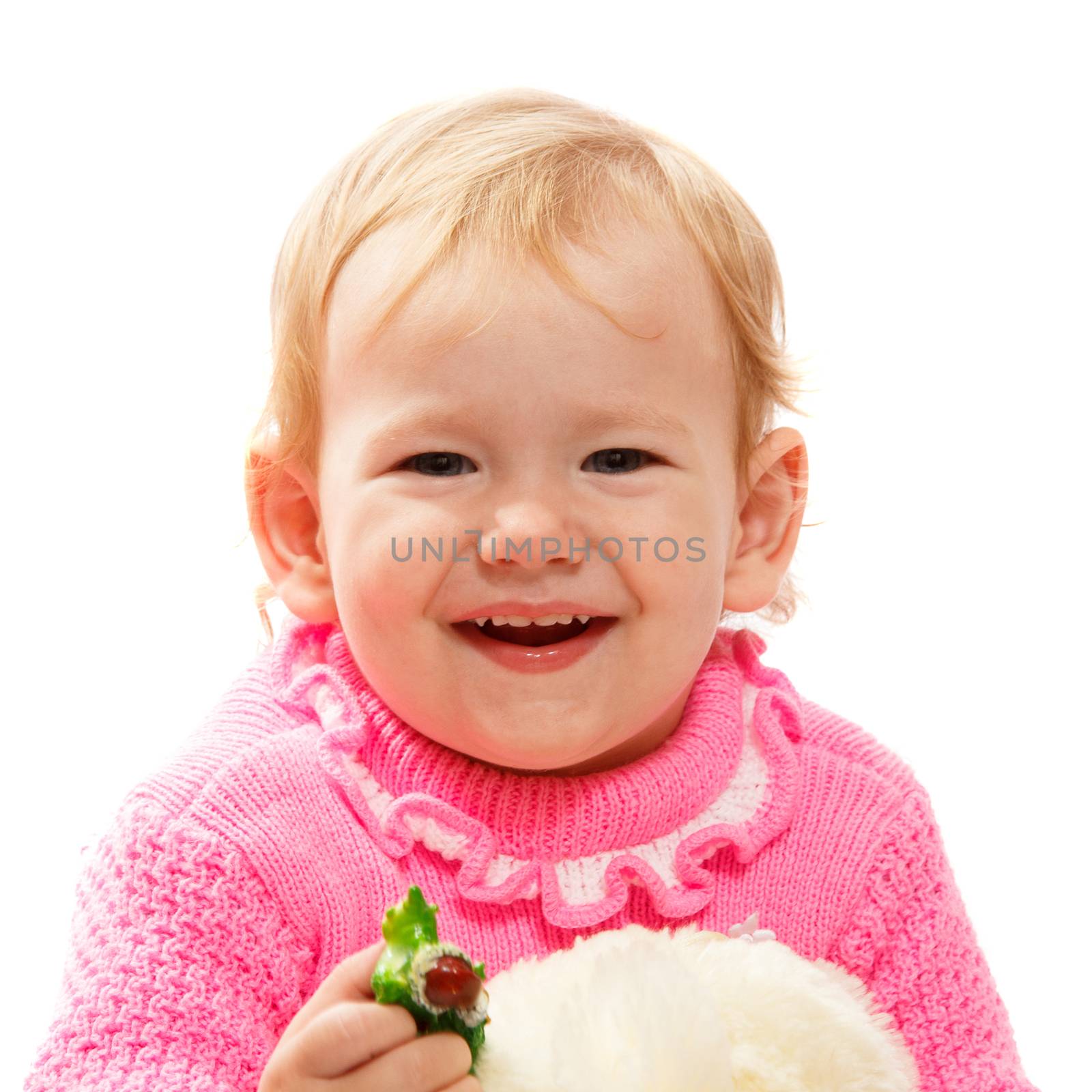A very young blond baby girl smiling widely