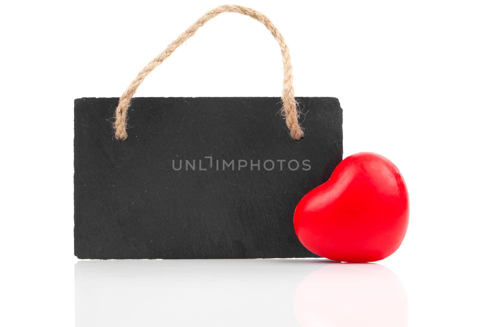 red heart with blackboard, on white wooden background