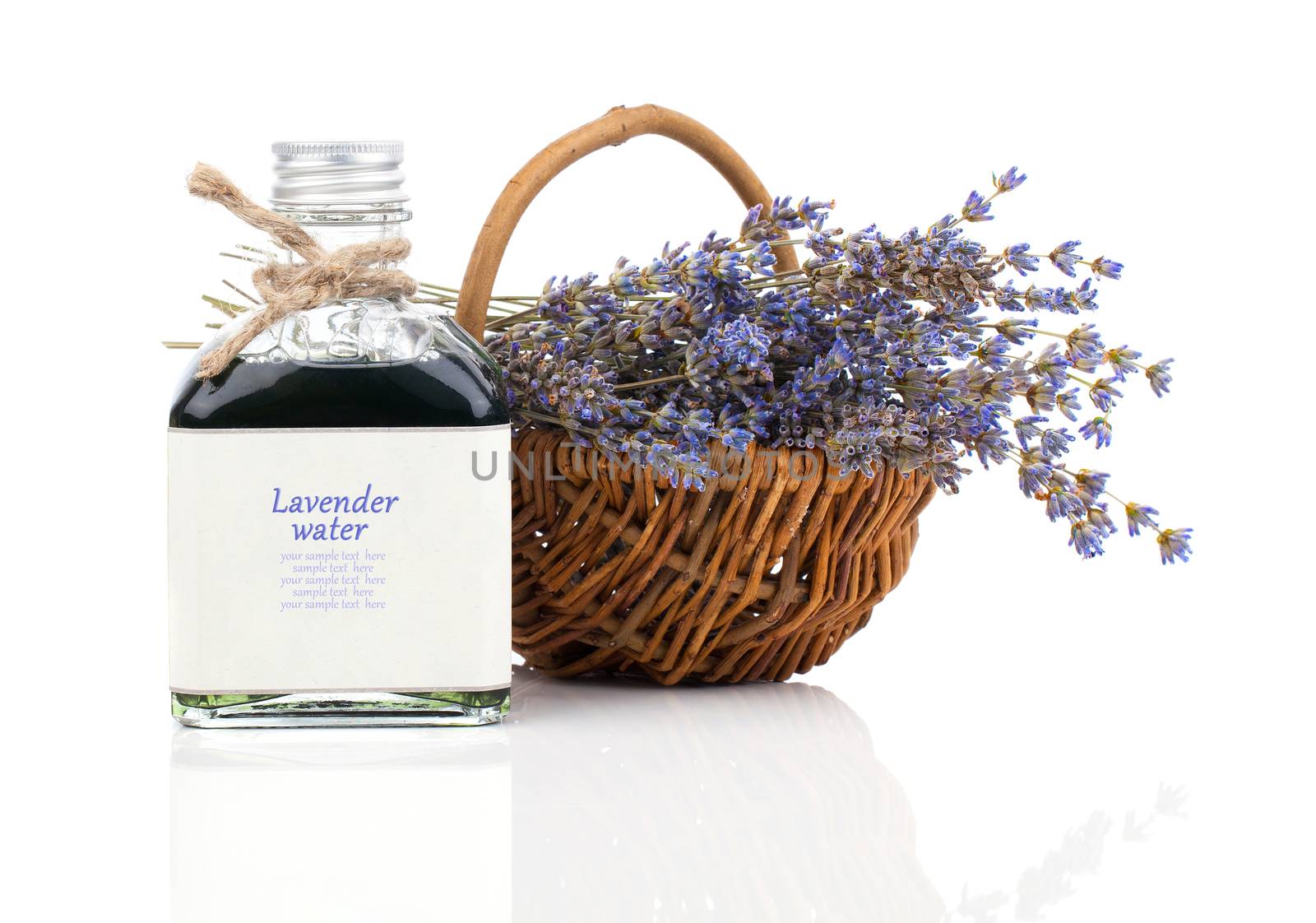 dry lavender flower in a basket with lavender water, isolated on white background