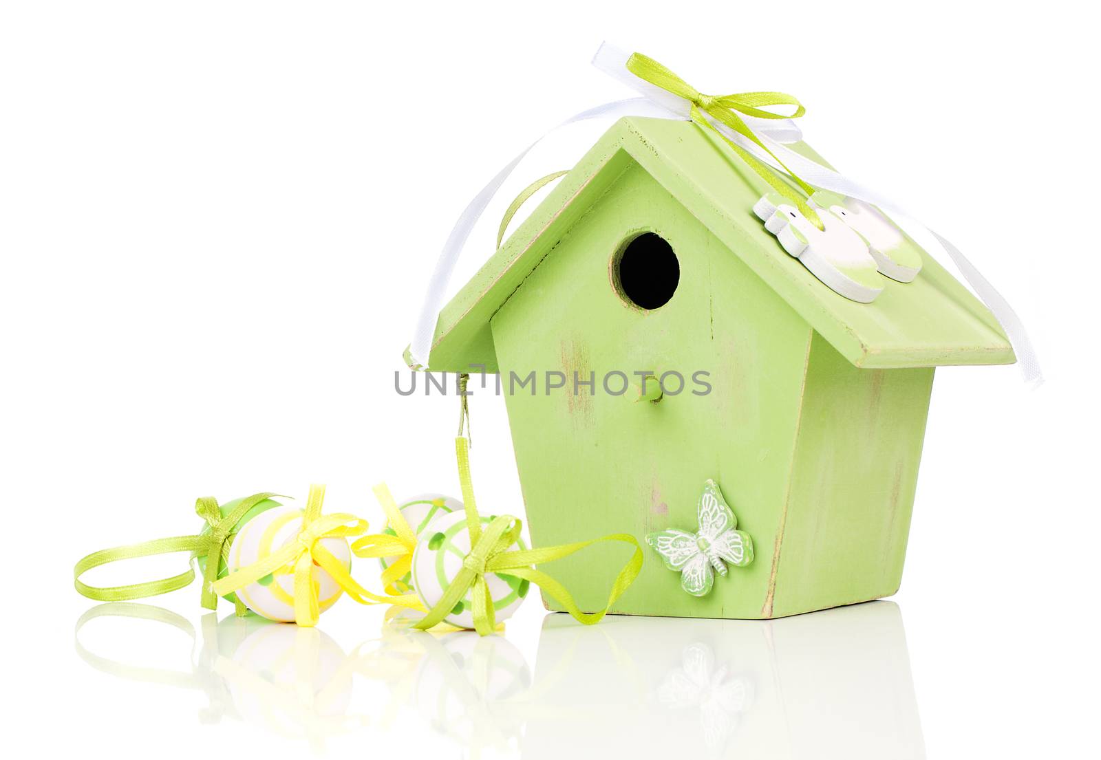 Easter eggs with birdhouse, on a white background