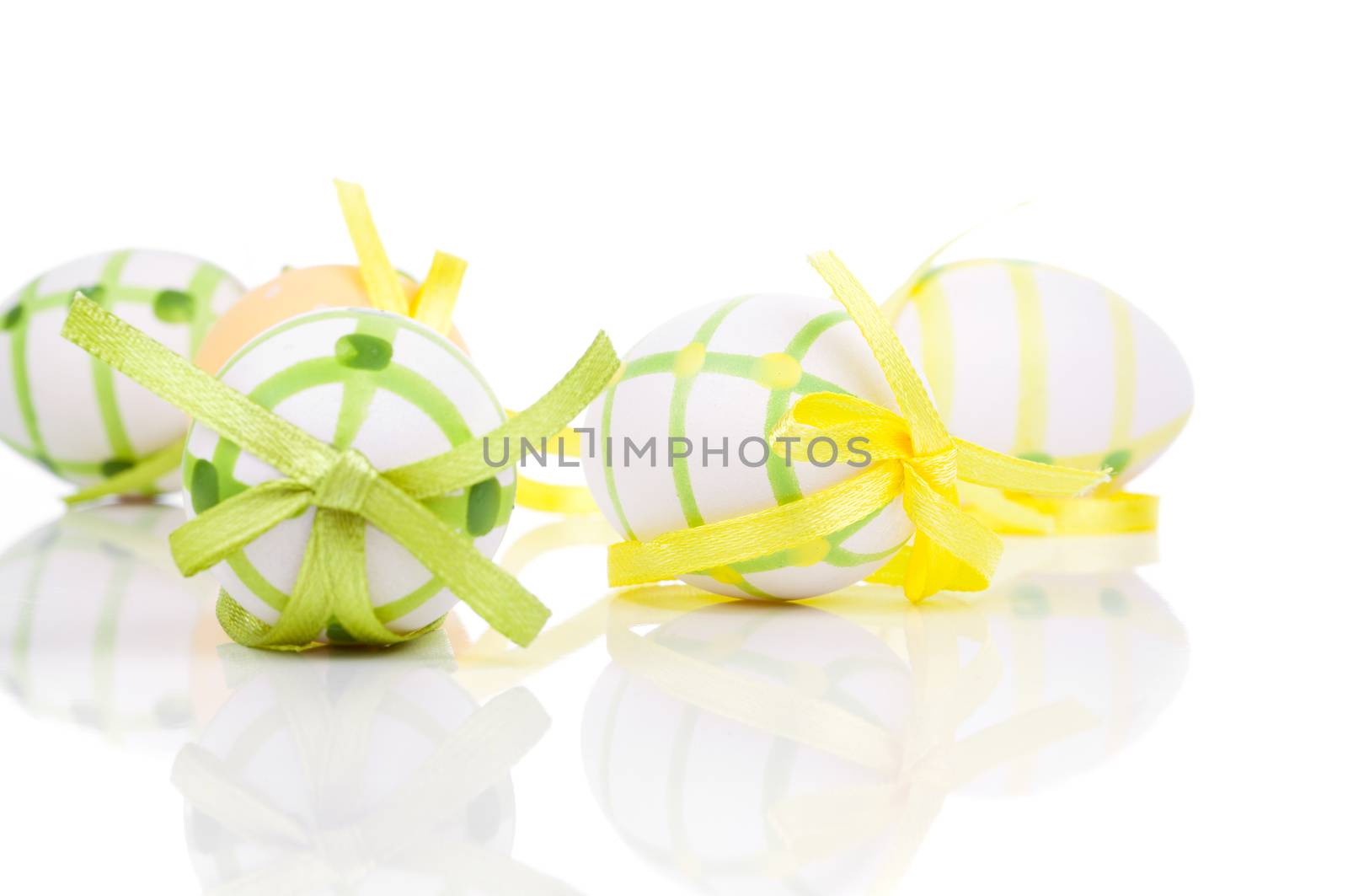close up of colorful easter eggs, on white background