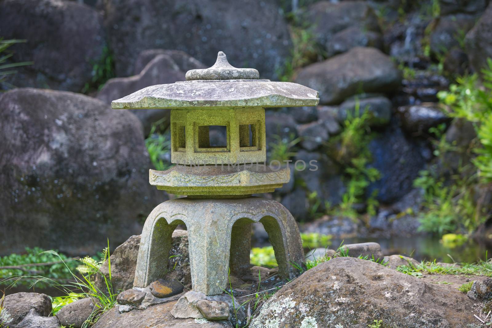 Beautiful Asian pagoda sculpture on rocks outdoors