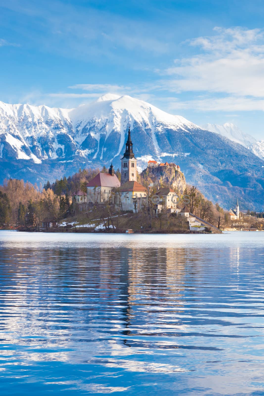 Panoramic view of Julian Alps, Lake Bled with St. Marys Church of the Assumption on the small island. Bled, Slovenia, Europe. 