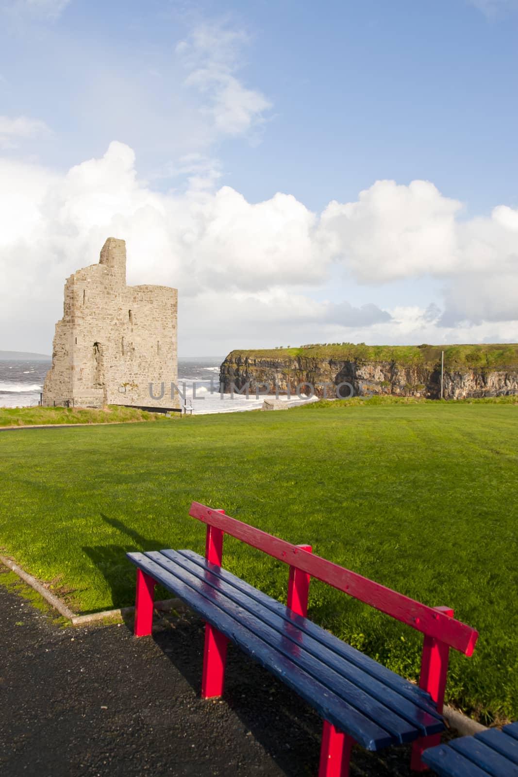 benches with views of Ballybunion castle and coast by morrbyte