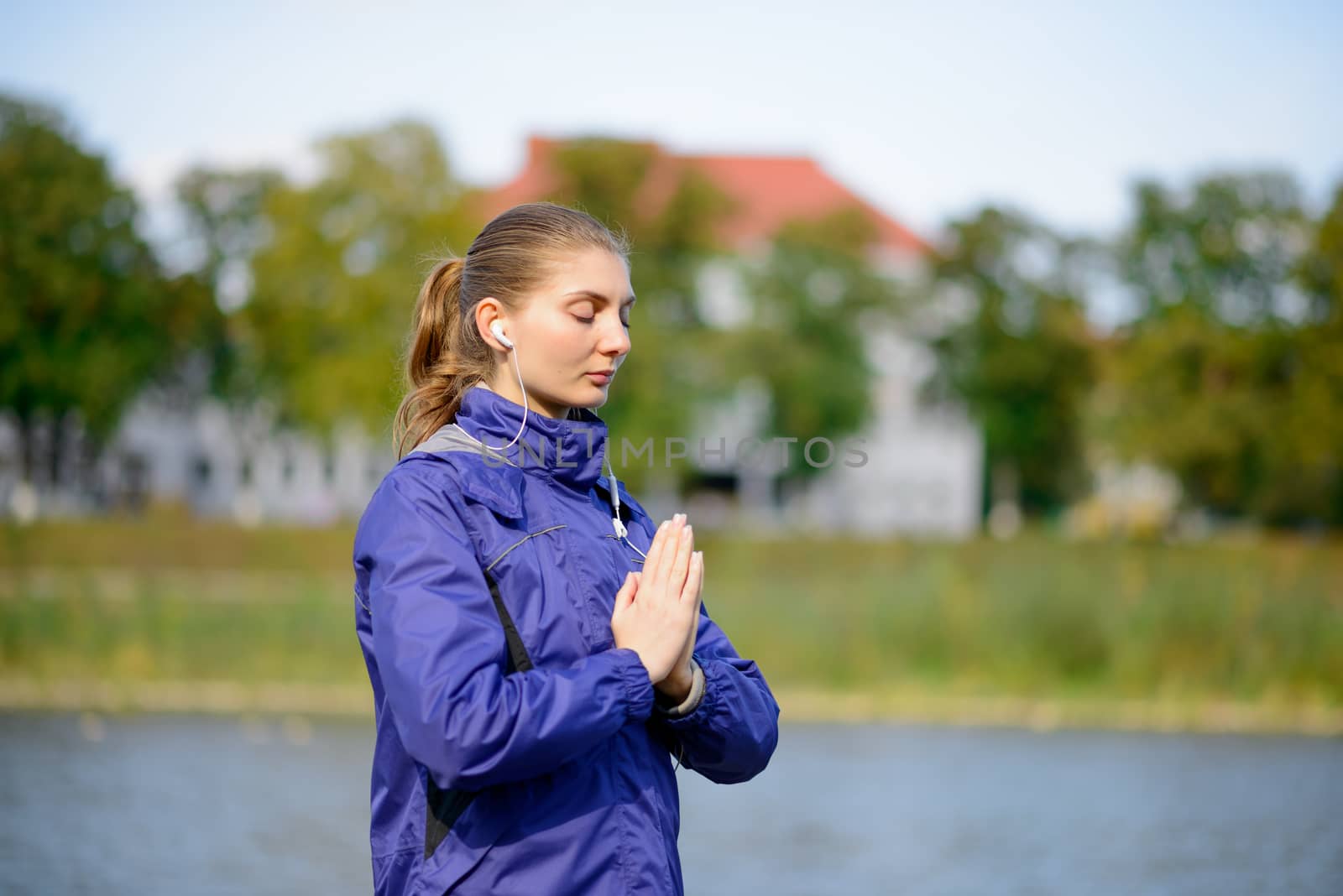Young Beautiful Woman Meditate on the River by maxpro