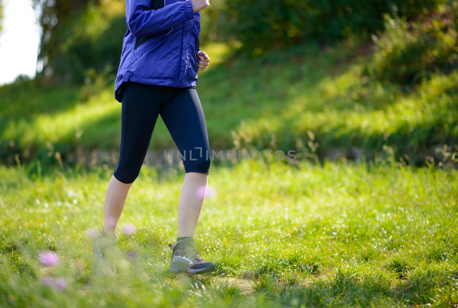 Young Beautiful Woman Running in the Park by maxpro