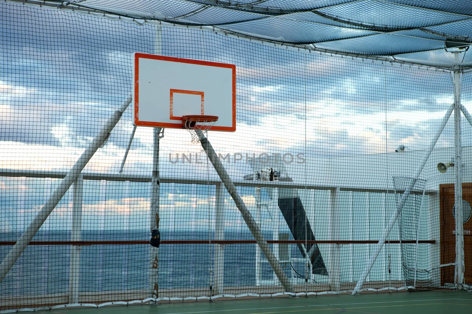 Basketball court and hoop with a view of the Atlantic ocean.