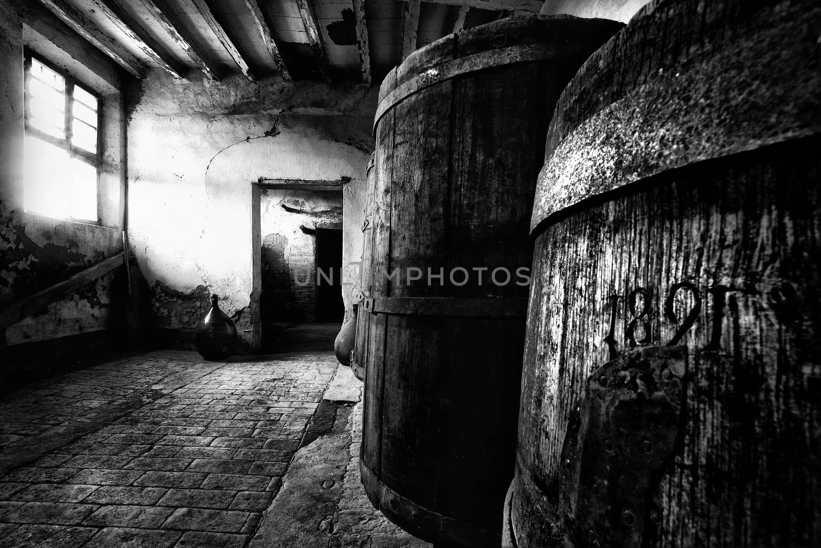A very old barrels inside an abandoned countryhouse.
