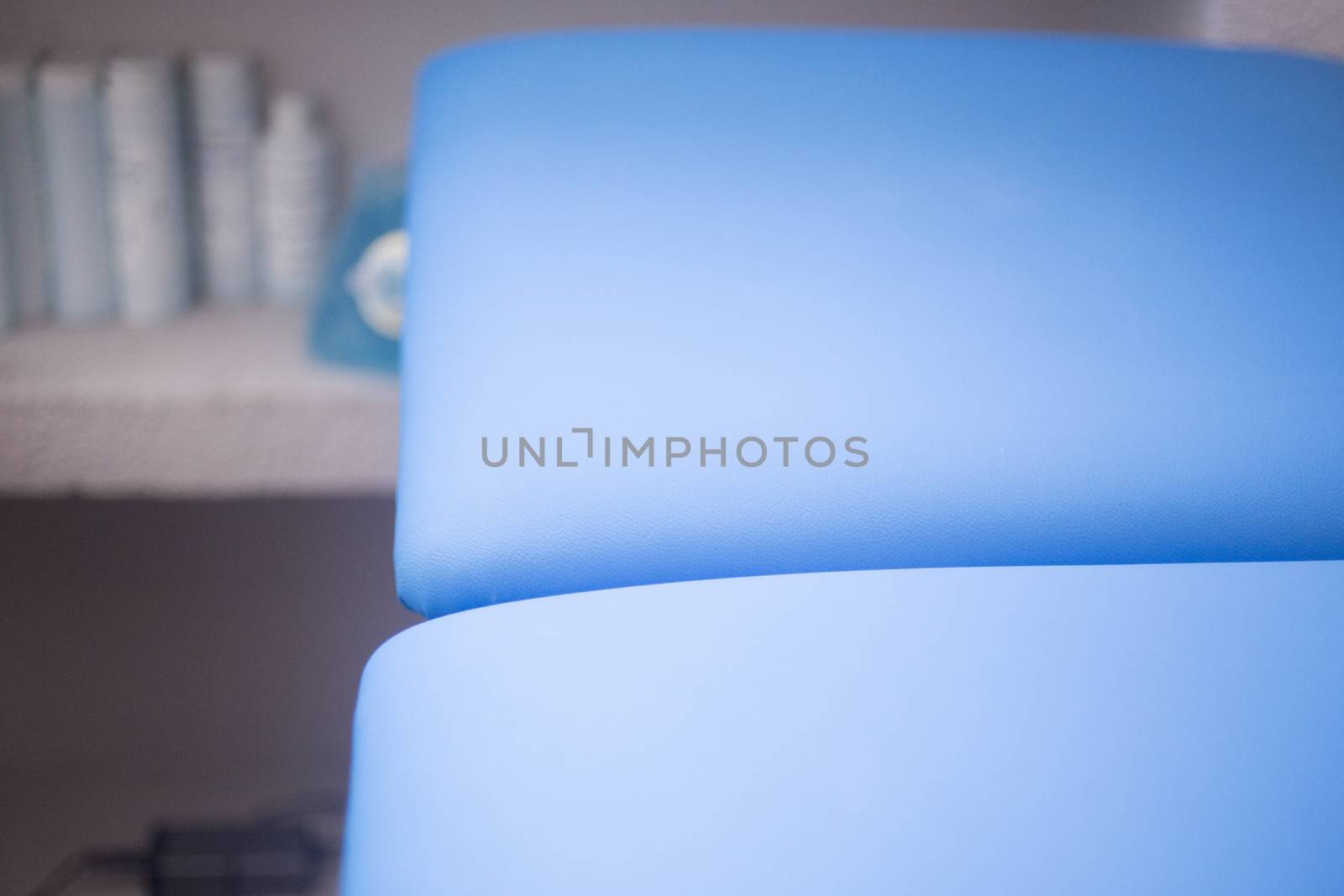 A bed in a physiotherapist's treatment area in hospital clinic.