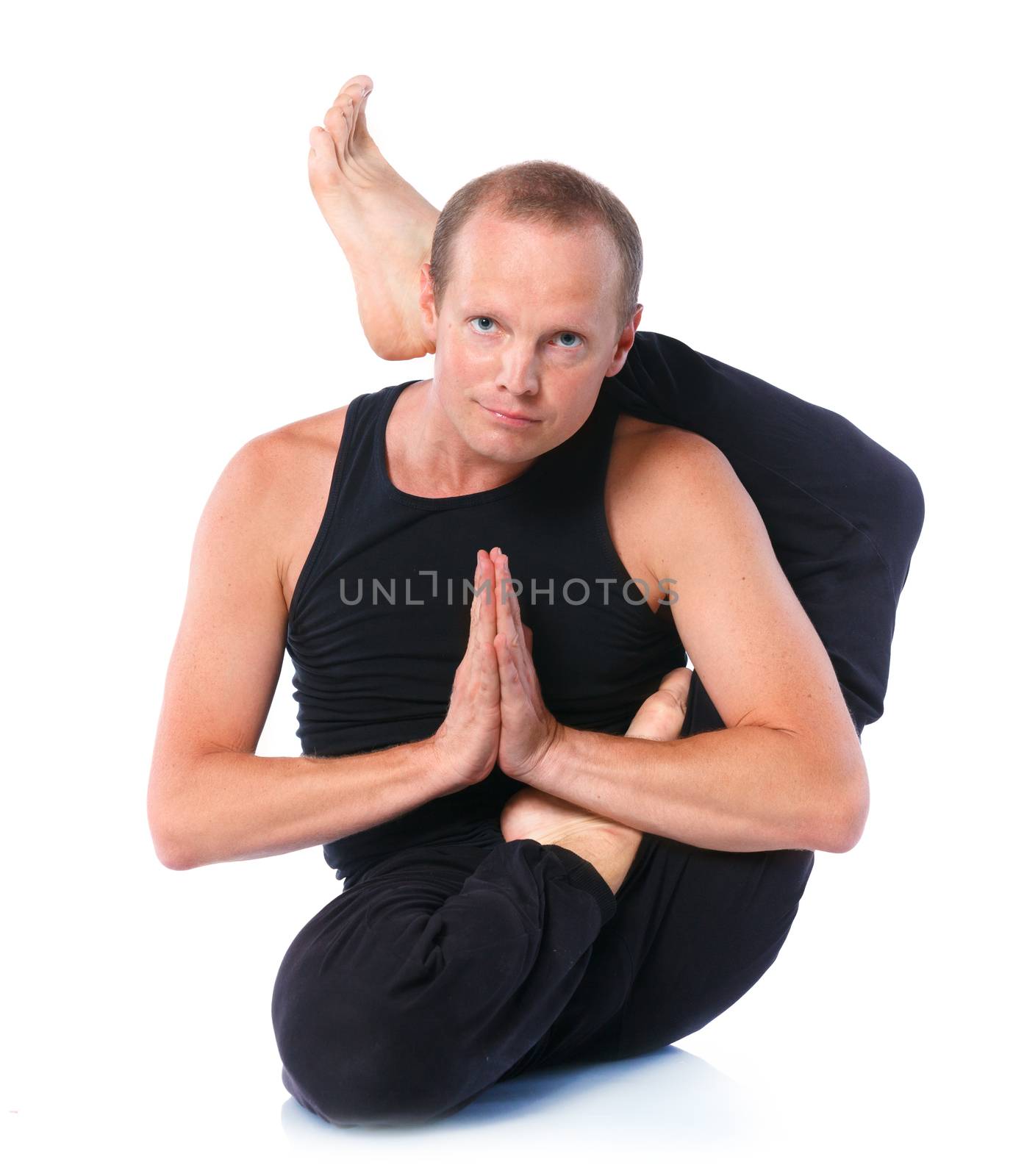 Young and handsome man doing yoga. Isolated on white backgraund
