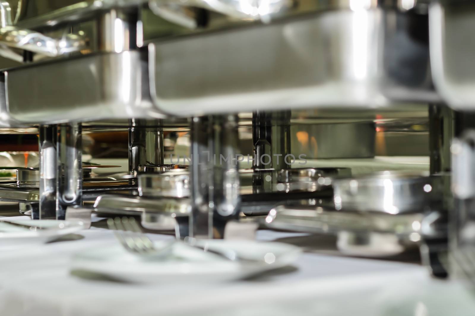 chafing dishes at table ready for wedding catering