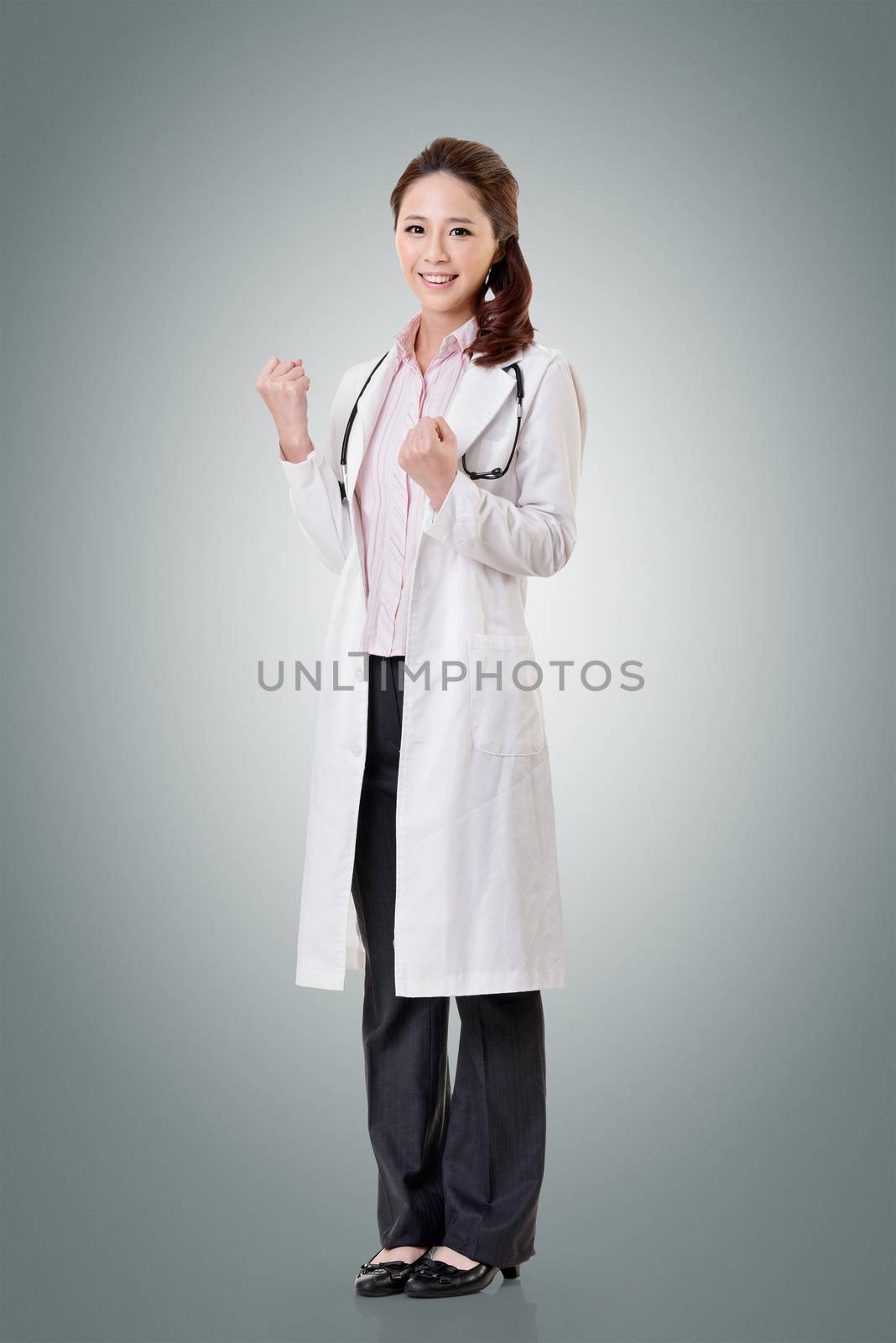 Cheerful Asian doctor woman dancing, full length portrait isolated on white background.