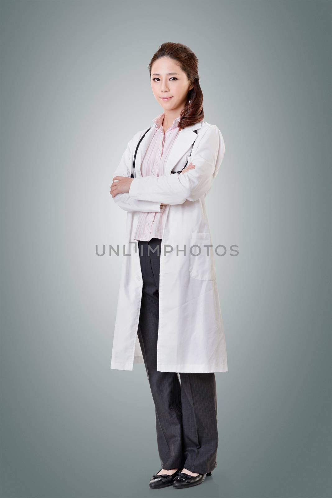 Friendly Asian doctor woman, full length portrait isolated.