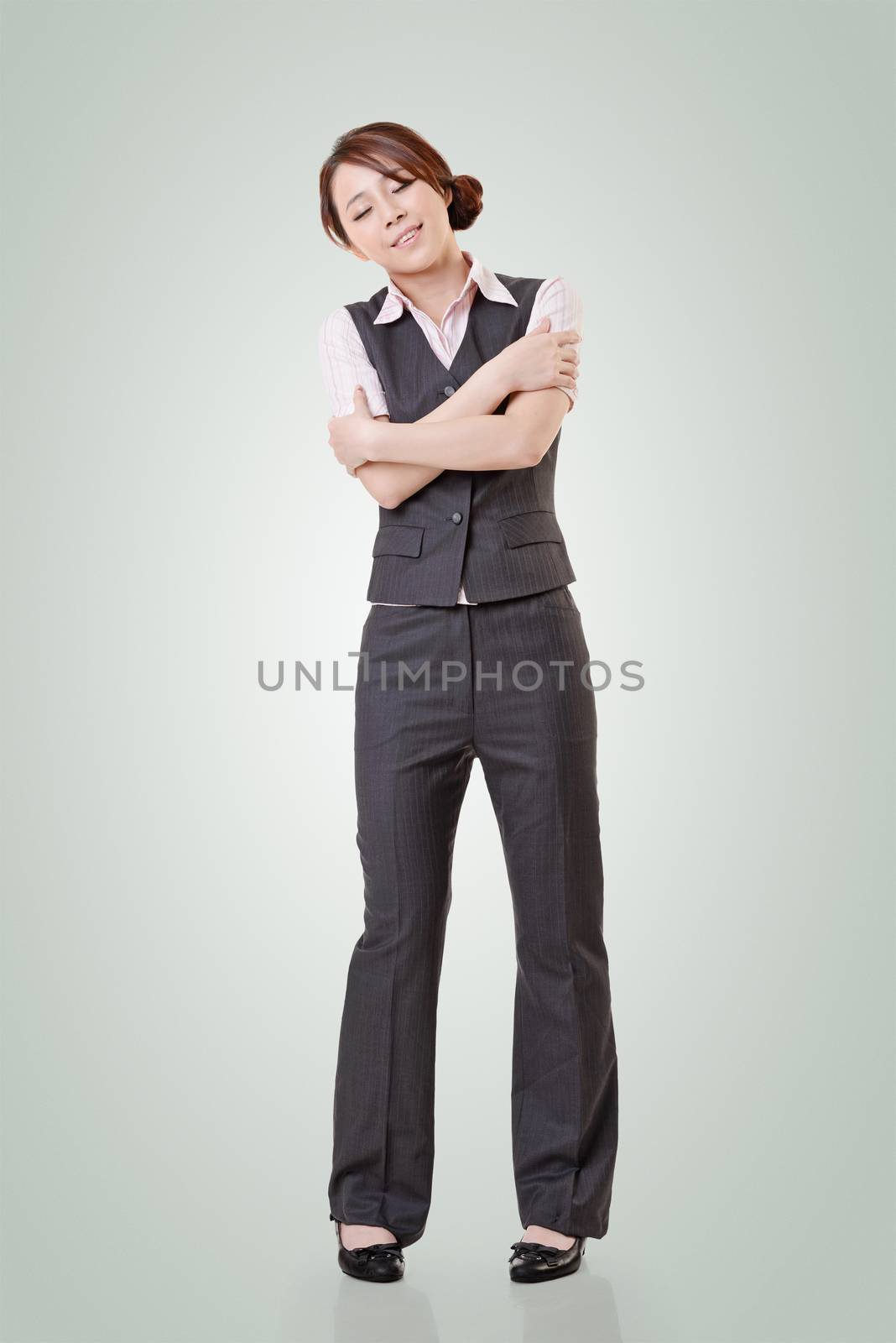 Attractive young business woman of Asian, full length portrait with clipping path.