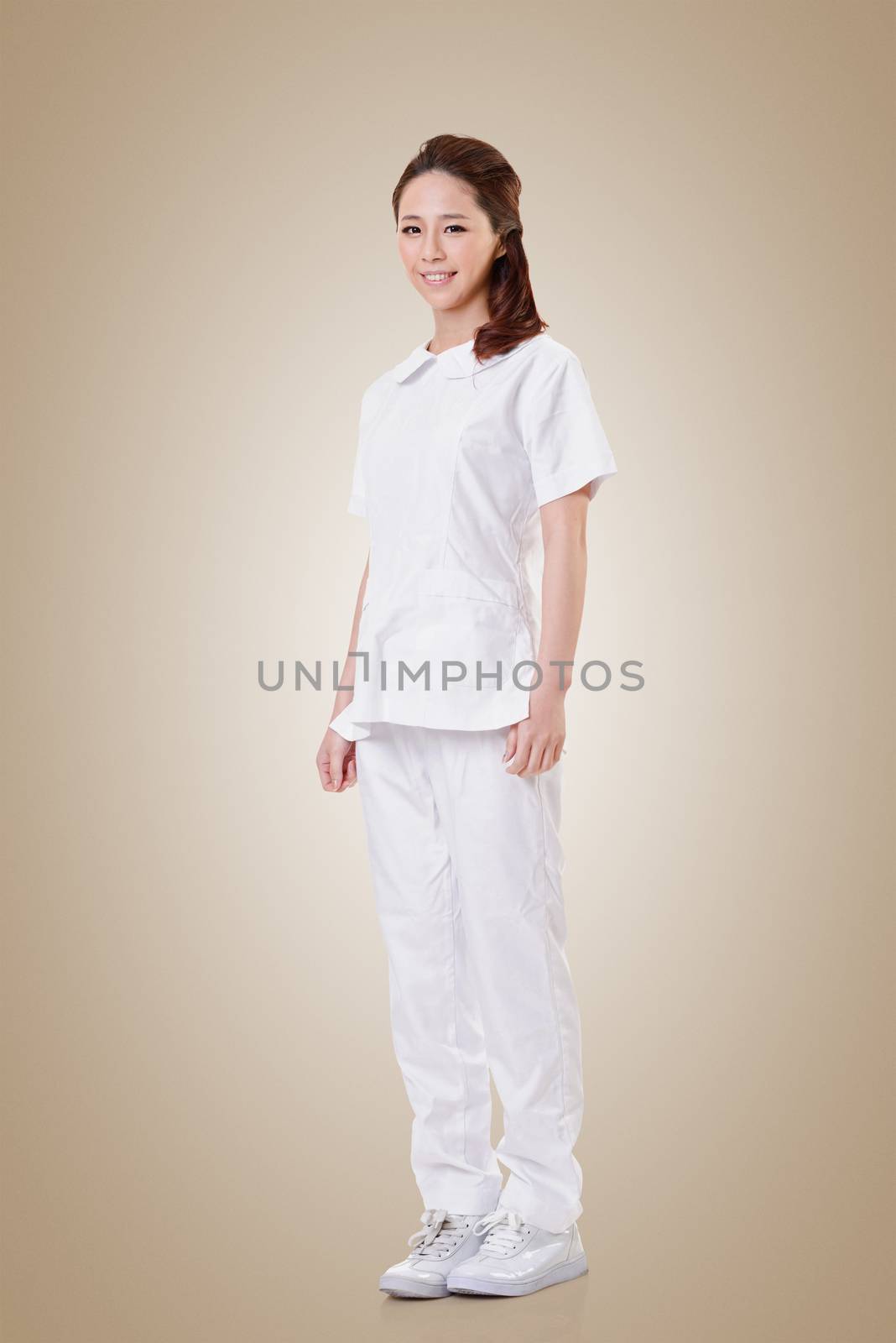 Attractive Asian nurse, woman portrait against white background.