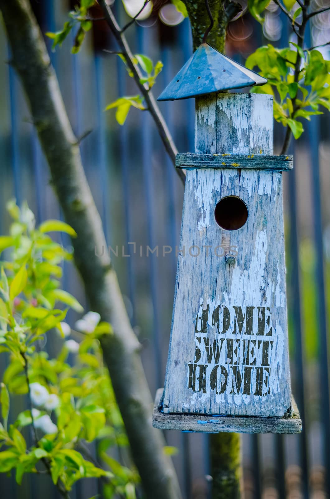 Retro Filtered Rustic Bird House With Home Sweet Home Printed On Peeling Paint