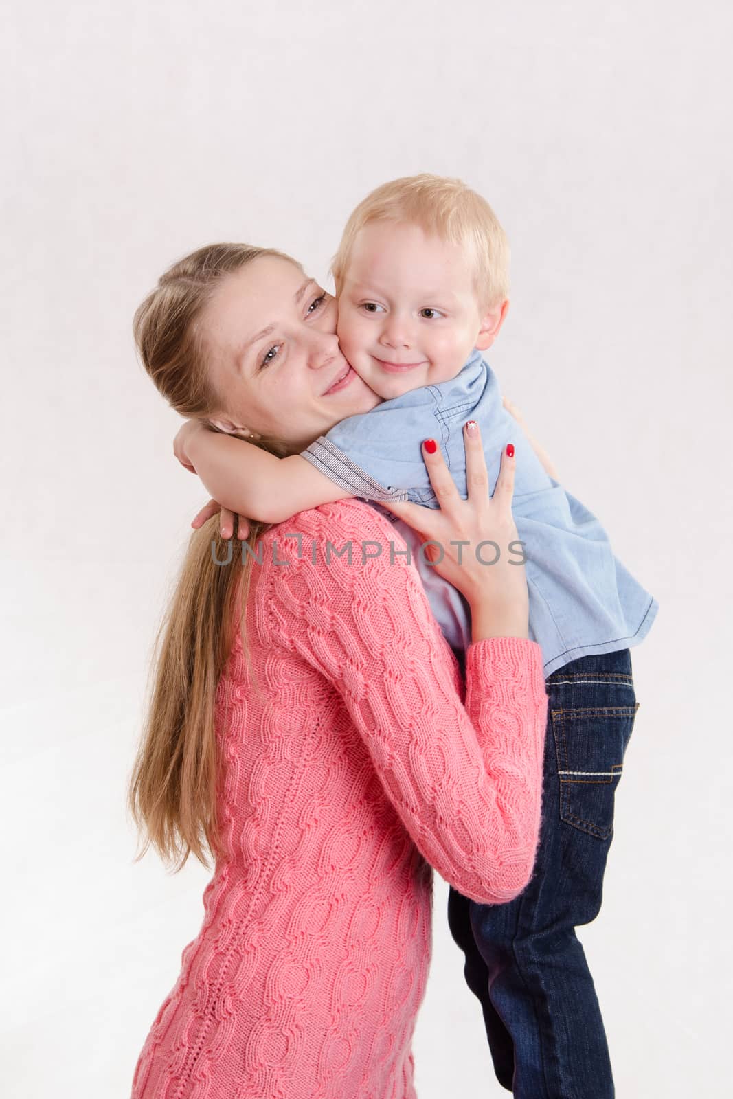 Young beautiful girl hugging his three sons