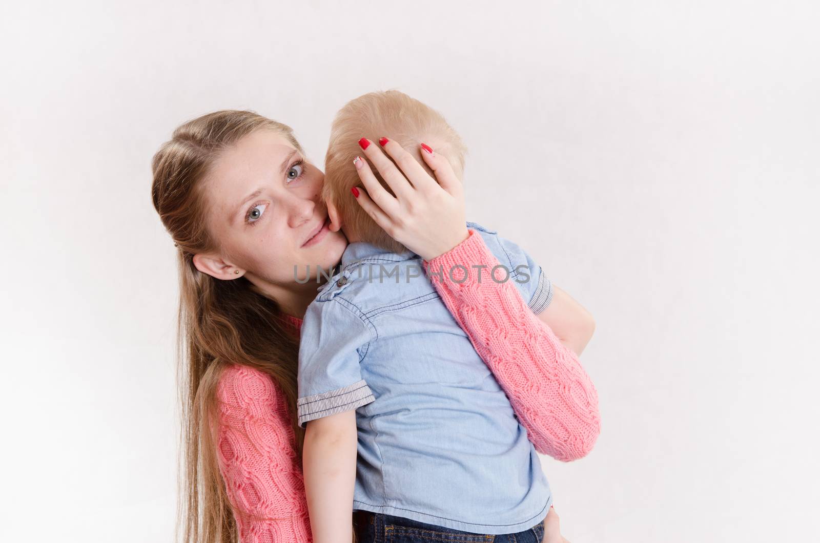 Young beautiful girl hugging his three sons