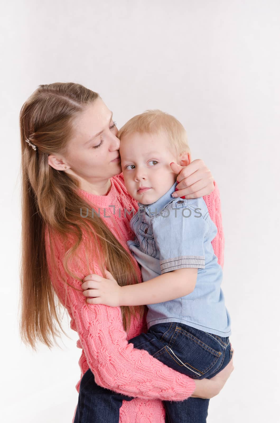 Young beautiful girl hugging his three sons