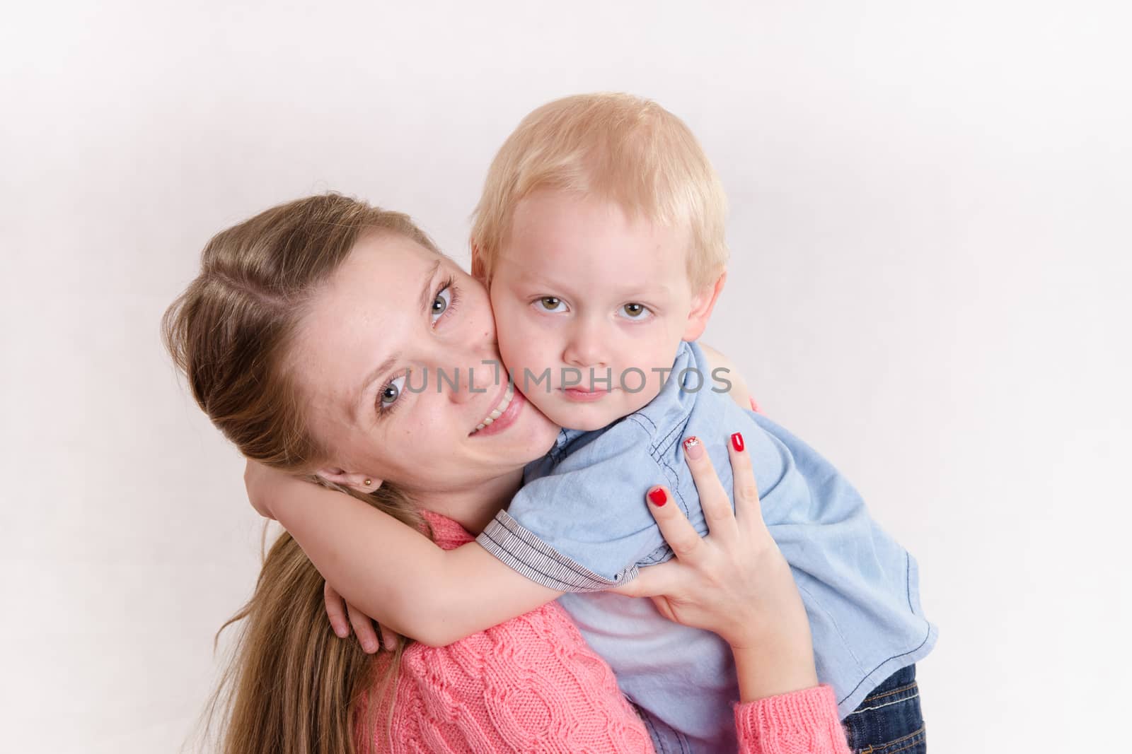 Young beautiful girl hugging his three sons