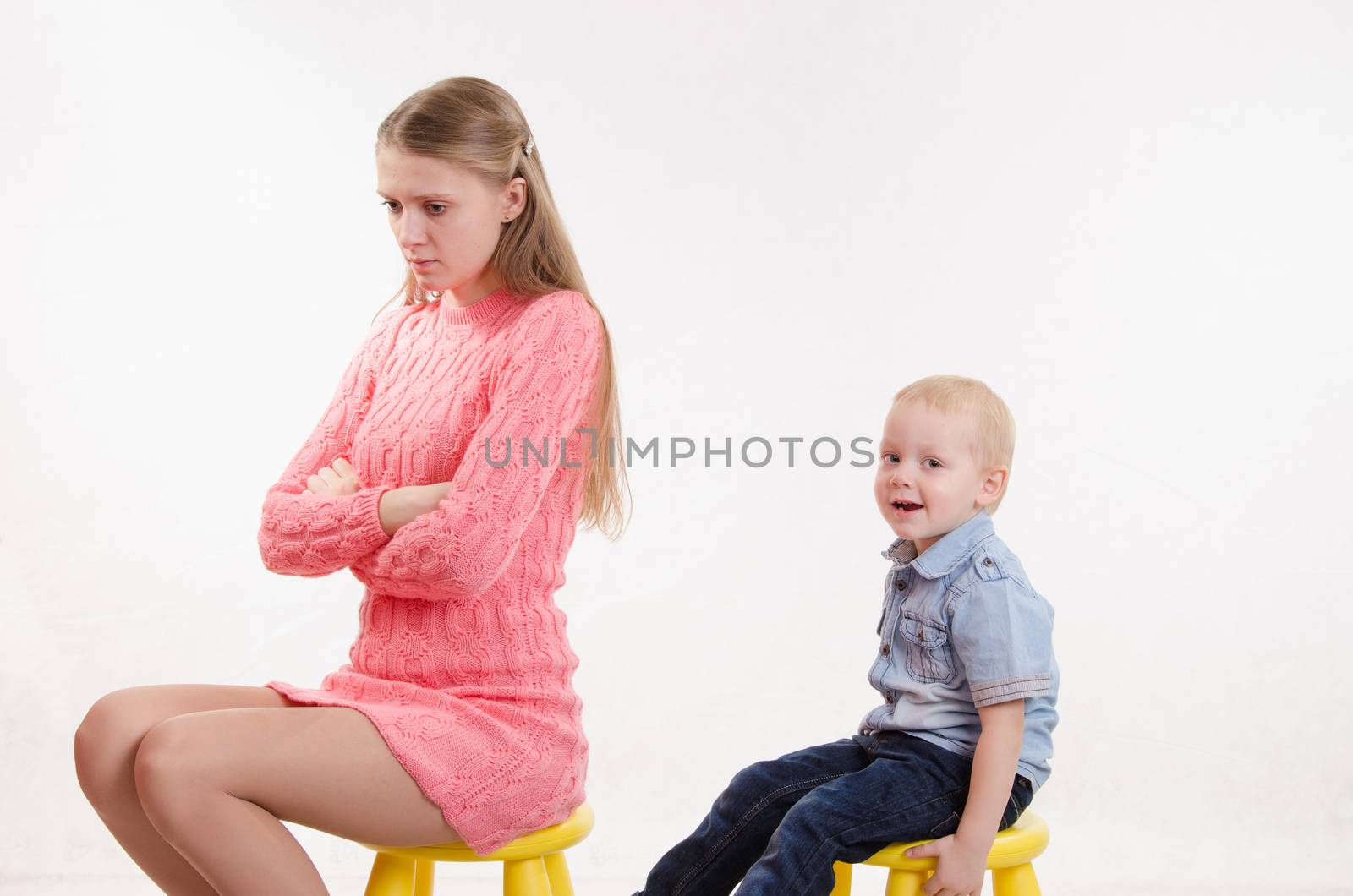 Young beautiful mother was mad at his disobedient and naughty year-old boy
