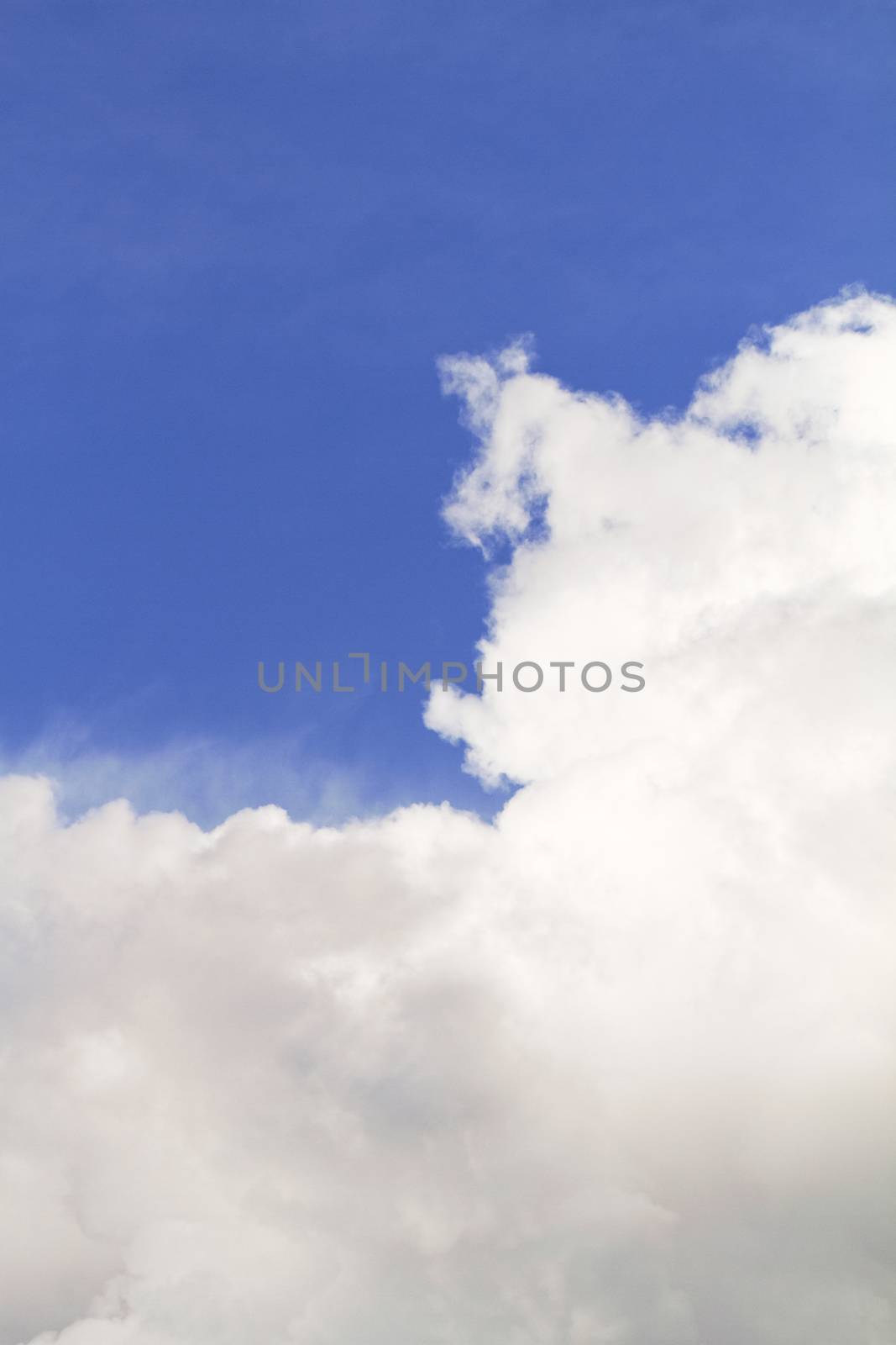 Blue sky background with white clouds - background