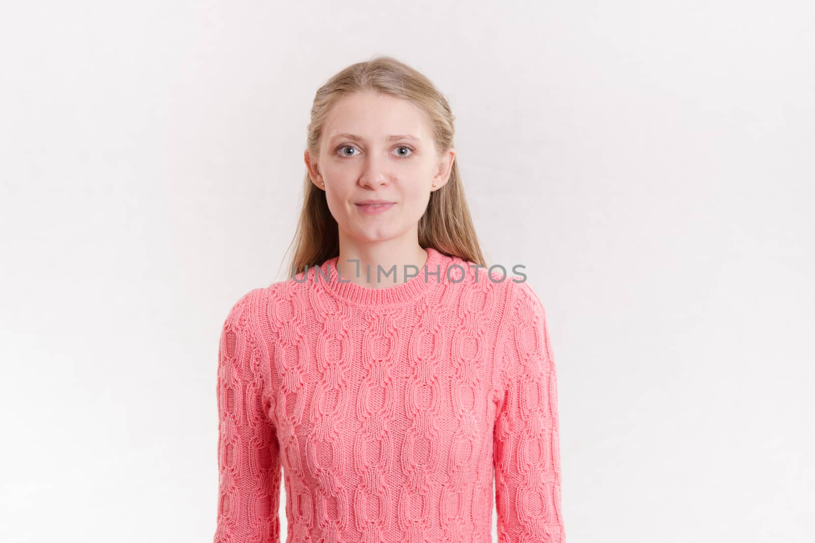 Portrait of a young emotional beautiful girl of the European appearance on a white background