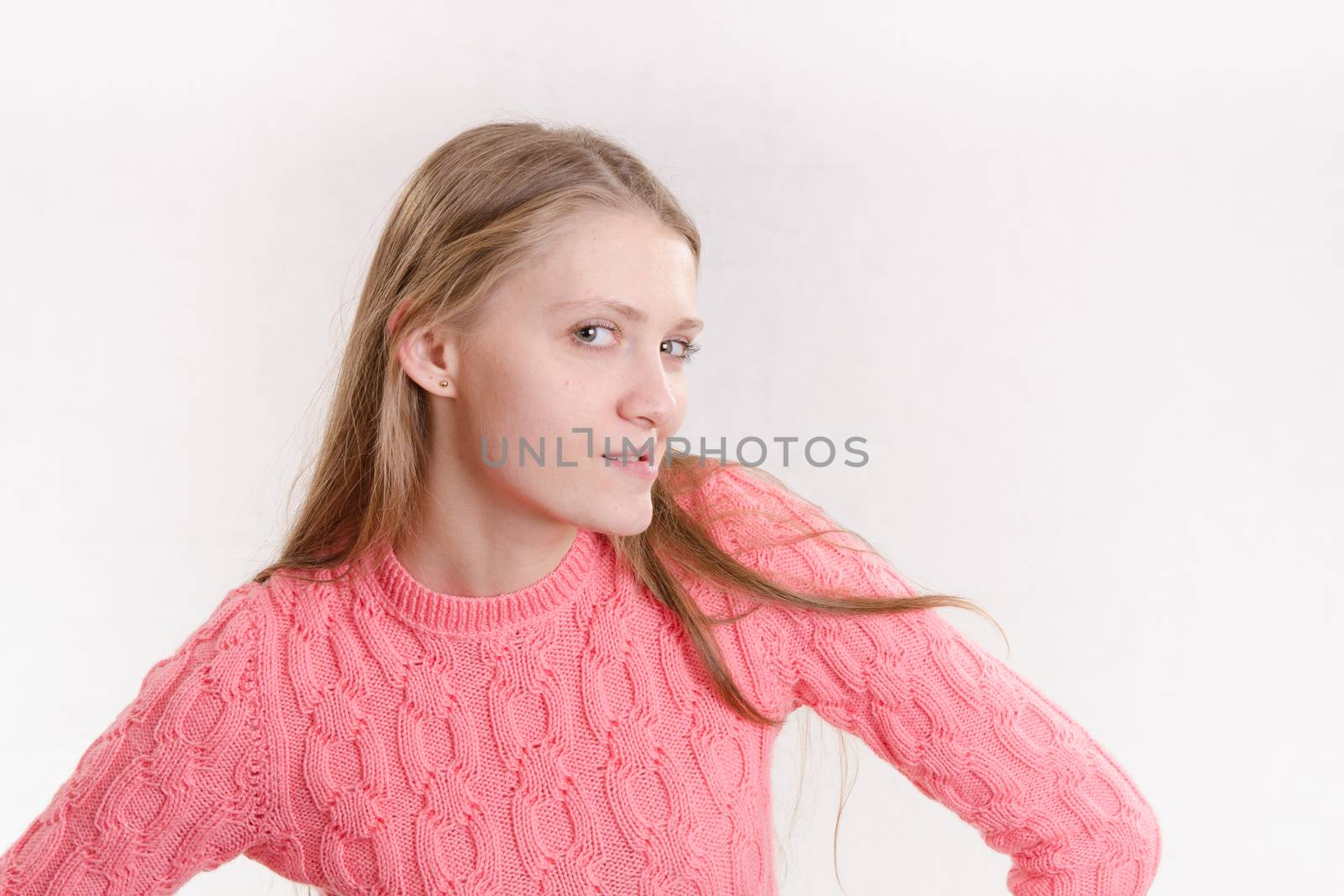 Portrait of a young emotional beautiful girl of the European appearance on a white background