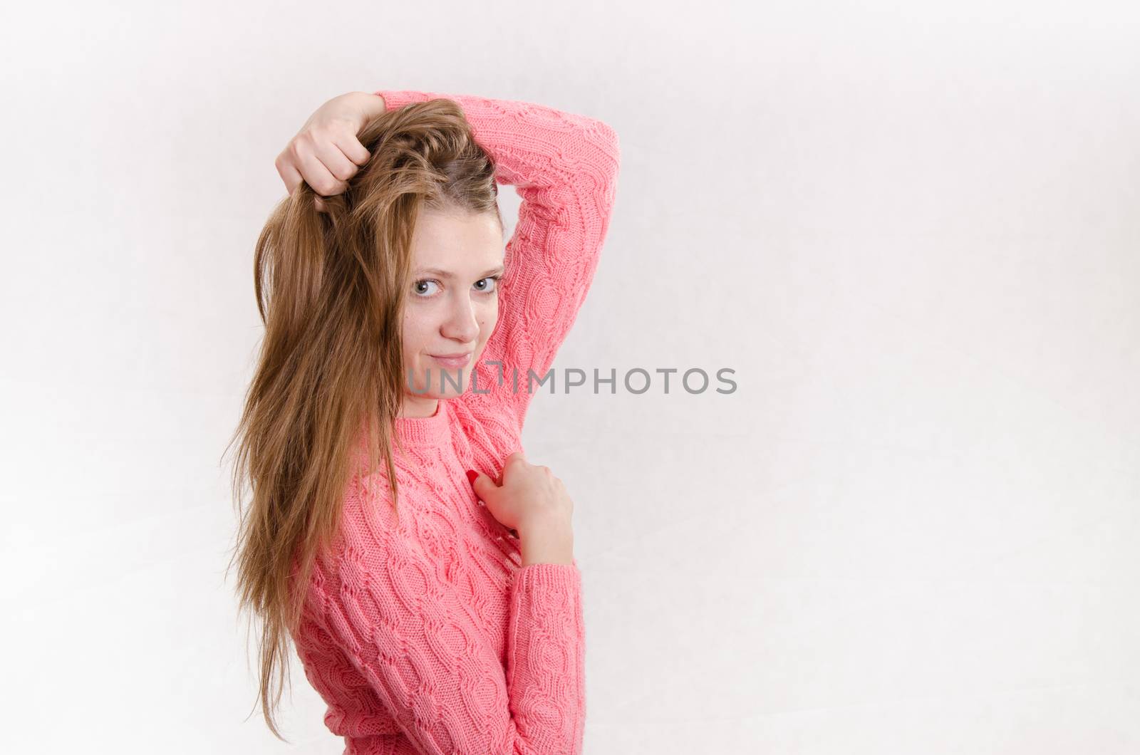 Portrait of a young emotional beautiful girl of the European appearance on a white background