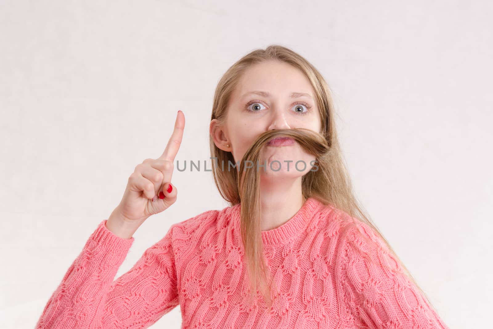 Portrait of a young emotional beautiful girl of the European appearance on a white background