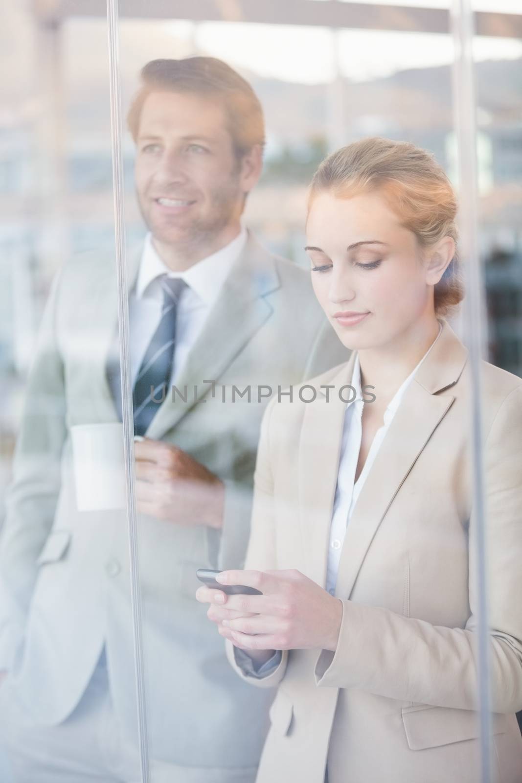 Business people looking out the window by Wavebreakmedia