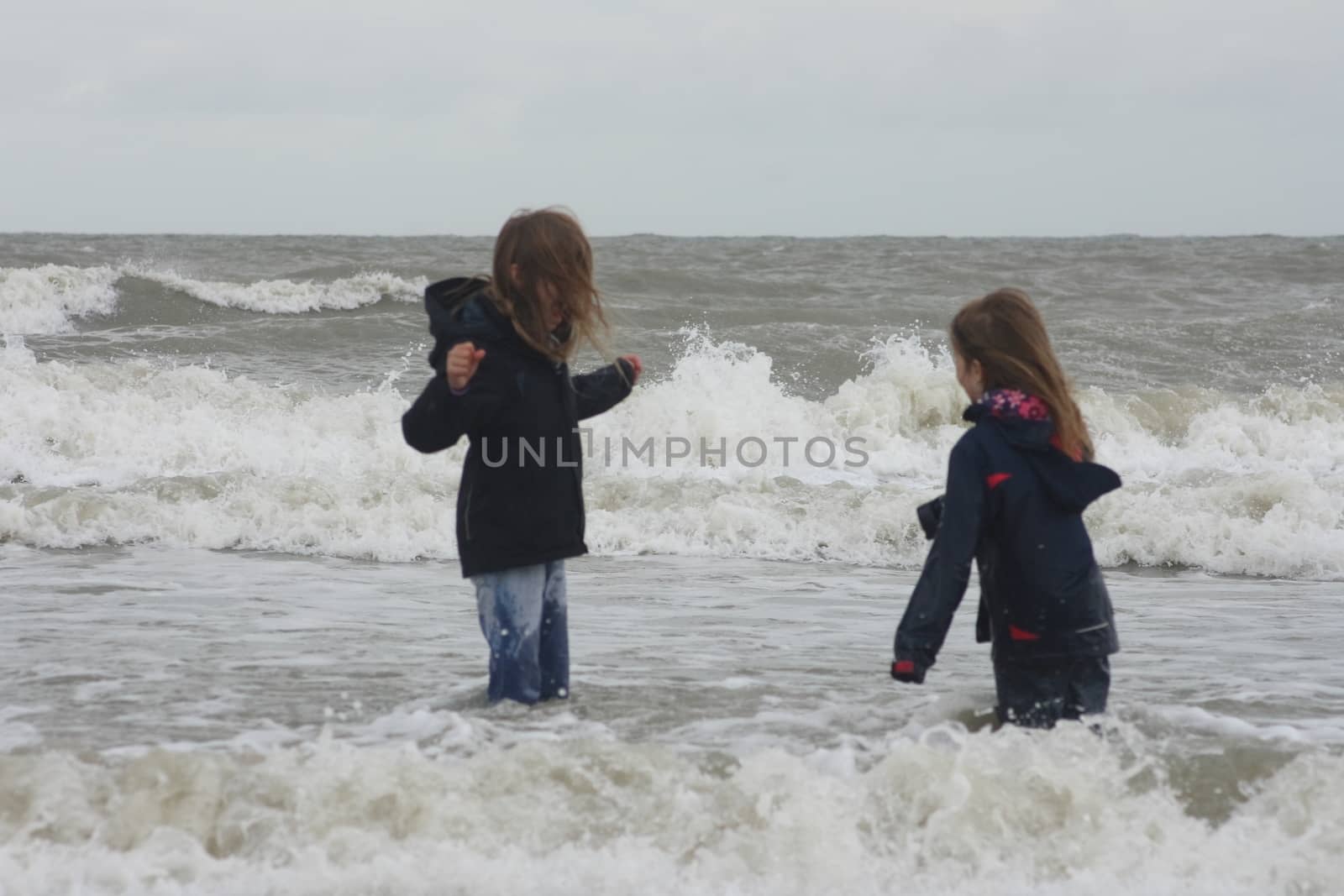 two blonde sisters on the beach 