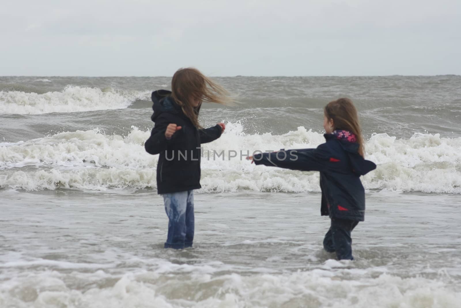 two blonde sisters on the beach 